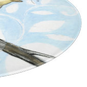 Kleine gele vogel die op een Tak wordt uitgevoerd  Snijplank (Hoek)