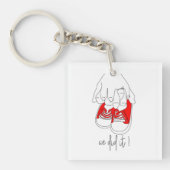 Kleine handen en kleine voetjes klaar om te poppen sleutelhanger (voorkant)