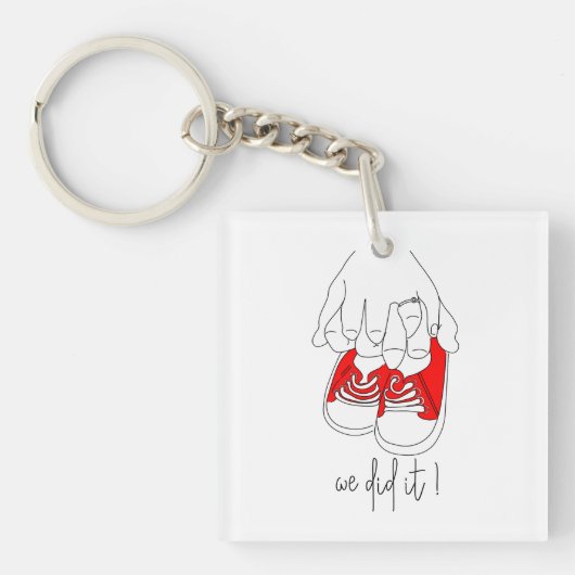 Kleine handen en kleine voetjes klaar om te poppen sleutelhanger (voorkant)