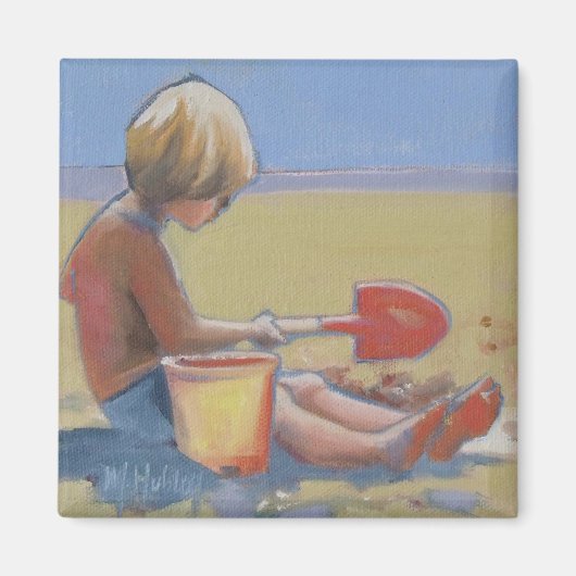 Kleine jongen die in het zand speelt met een schop magneet (Voorkant)