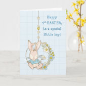 Kleine jongen eerste paashaas op bloemenschommel kaart (Gele Bloem)