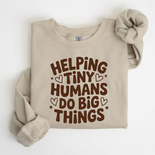 Kleine Mensen Helpen om Grote Dingen te Doen T-shirt
