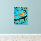 Kleine Oranje vogel op een bloeiende tak Canvas Afdruk (Insitu (Houten vloer))