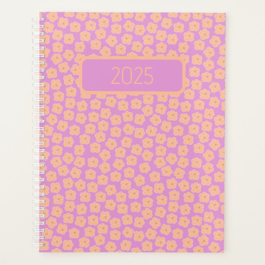 Kleine perzikkleurige bloemen op roze planner (Voorkant)