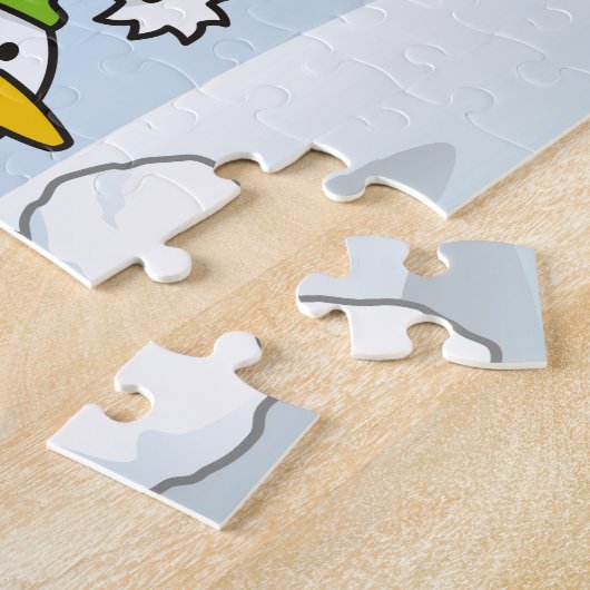 Kleine pinguïn die een sneeuwbal krijgt legpuzzel (Zijkant)