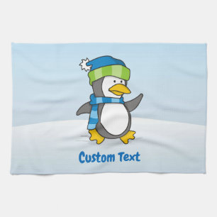 Kleine pinguïn die op een sneeuwkeukendoek loopt theedoek