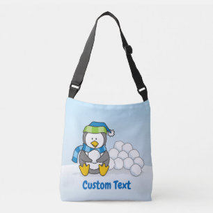 Kleine pinguïn zittend met sneeuwballen crossbody tas
