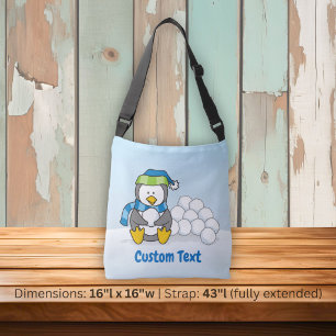 Kleine pinguïn zittend met sneeuwballen overdwars crossbody tas