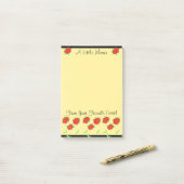 Kleine rode bloem ontworpen post-it® notes (Op bureau)