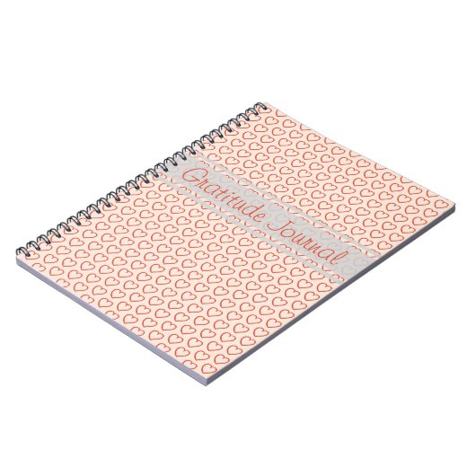 Kleine rode harten op roze notitieboek (Linkerzijde)