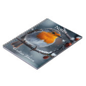 Kleine roodborstvogel zit op een tak in de winter notitieboek (Linkerzijde)