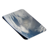 Kleine satellieten draaien boven een deel van de a magneet (Rechterzijde)