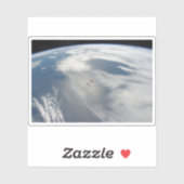 Kleine satellieten draaien boven een deel van de a sticker (Vel)