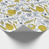 Kleine schooldingen verspreid over cadeaupapier (Hoek)