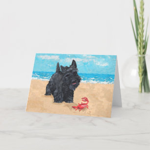 Kleine Scottie vindt een krab op het strand Kaart