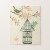 Kleine vogels op een bijkantoor en op een vogelkoo legpuzzel (Verticaal)