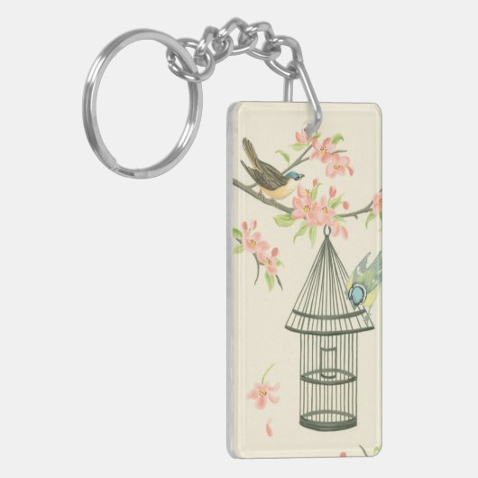 Kleine vogels op een bijkantoor en op een vogelkoo sleutelhanger (Voorkant Links)