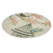 Kleine vogels op een bijkantoor en op een vogelkoo snijplank (Hoek)