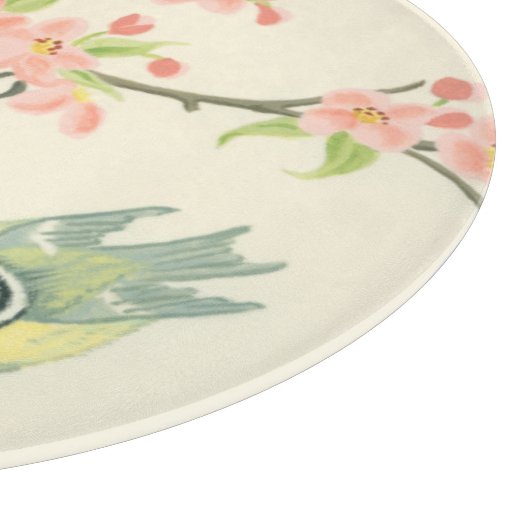 Kleine vogels op een bijkantoor en op een vogelkoo snijplank (Hoek)