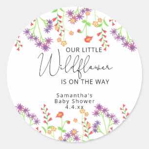 Kleine wilde bloemen zijn op weg ronde sticker