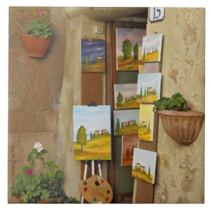 Kleine winkel met kunstwerk te koop op het trottoi tegeltje