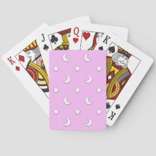 Kleine witte sterren en manen op roze pokerkaarten