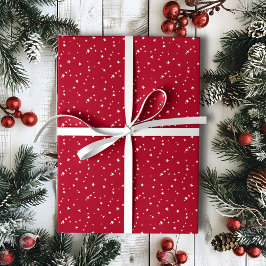 Kleine witte sterren op rode kerst cadeaupapier