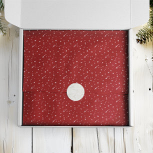 Kleine witte sterren op rode kerst tissuepapier