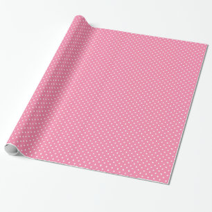 Kleine witte stippen op hete roze cadeaupapier