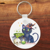 Kleine zwarte hekkkat met een tas van een cauldron sleutelhanger (Voorkant)