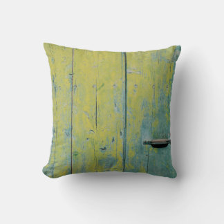 Klepfoto van geel en blauwgroen houten bord kussen