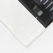 Kleurafbeelding van vele knoppen in een geluidsopn fleece deken (Hoek)