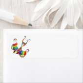 Kleurrijk etiket met retouradres van slikken (Insitu)