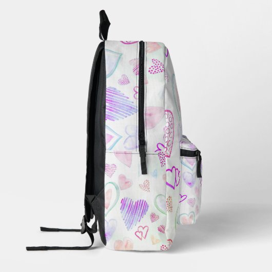 Kleurrijk hartpatroon over wit bedrukte rugzak (Links)
