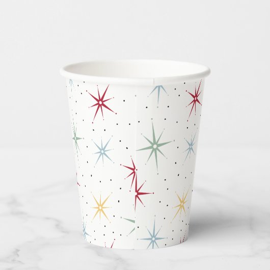 Kleurrijke atoomstartbarst uit het midden van de e papieren bekers (Rechts)