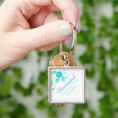 Kleurrijke bloem in blauwe ogen sleutelhanger (Hand)