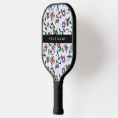 Kleurrijke bloemen, blauwe achtergrond, zwart pickleball paddle (Links)