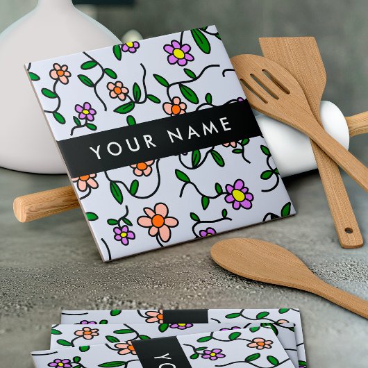 Kleurrijke bloemen, blauwe achtergrond, zwart tegeltje