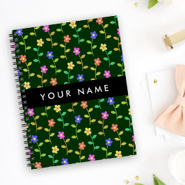 Kleurrijke bloemen, groene achtergrond, zwart notitieboek