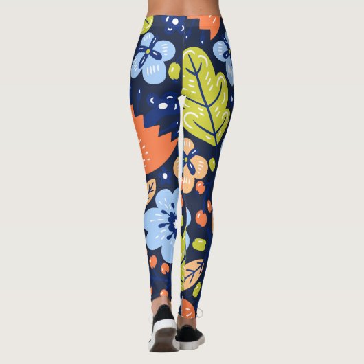 Kleurrijke bloemen op donkere marineblauwe achterg leggings (Achterkant)