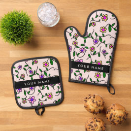 Kleurrijke bloemen, roze achtergrond, zwart ovenwant & pannenlap set