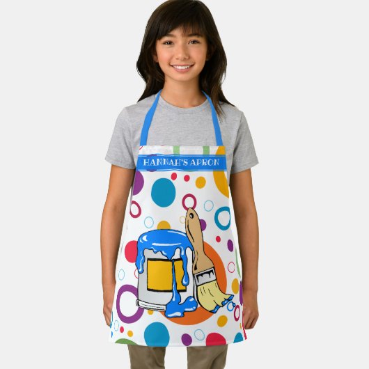 Kleurrijke cirkels en een rommelige verf kunnen en schort (Insitu)