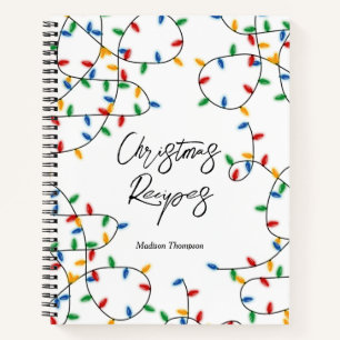 Kleurrijke feestelijke kerstlampjes met kerstrecep notitieboek