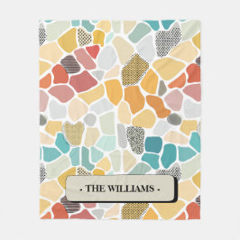 Kleurrijke geometrische met een monogram fleece deken