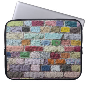 Kleurrijke geschilderde bakstenen wandtextuur laptop sleeve
