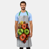 Kleurrijke gestripte tomaten op de weerstabel schort (Gedragen)