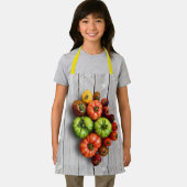 Kleurrijke gestripte tomaten op de weerstabel schort (Insitu)