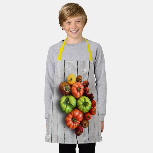 Kleurrijke gestripte tomaten op de weerstabel schort (Gedragen)