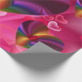 Kleurrijke harten in hartroze cadeaupapier (Hoek)