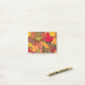 Kleurrijke herfstbladeren post-it® notes (Op bureau)
